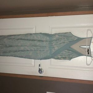 A dark turquoise jump suit